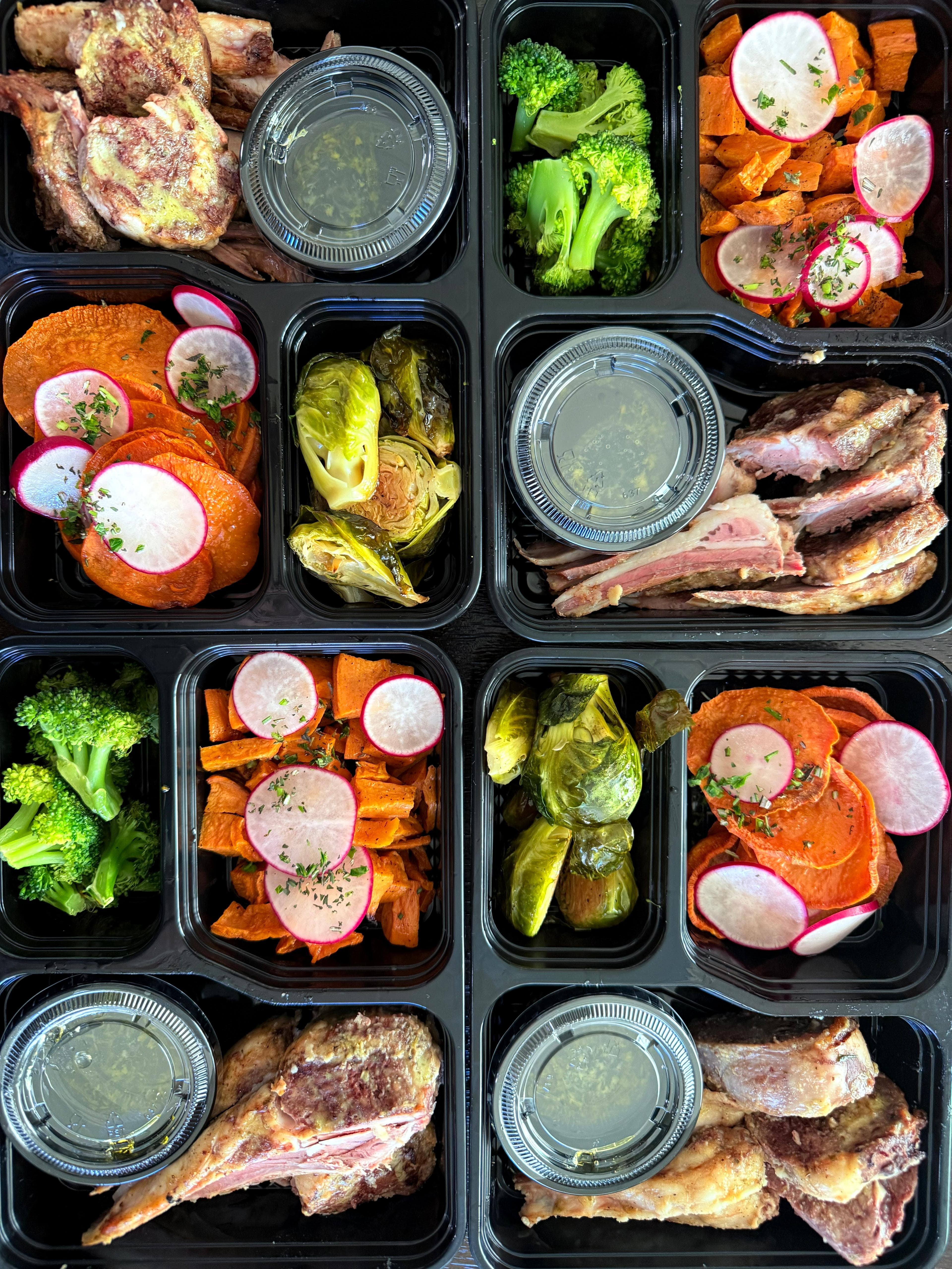 Chef-prepared meal trays with protein, vegetables, and sweet potato delivered weekly by MV Calisthenics in Seattle.